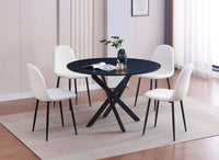 Table de repas ronde avec 4 chaises blanches, plateau en MDF, pieds en métal noir, décoration moderne.